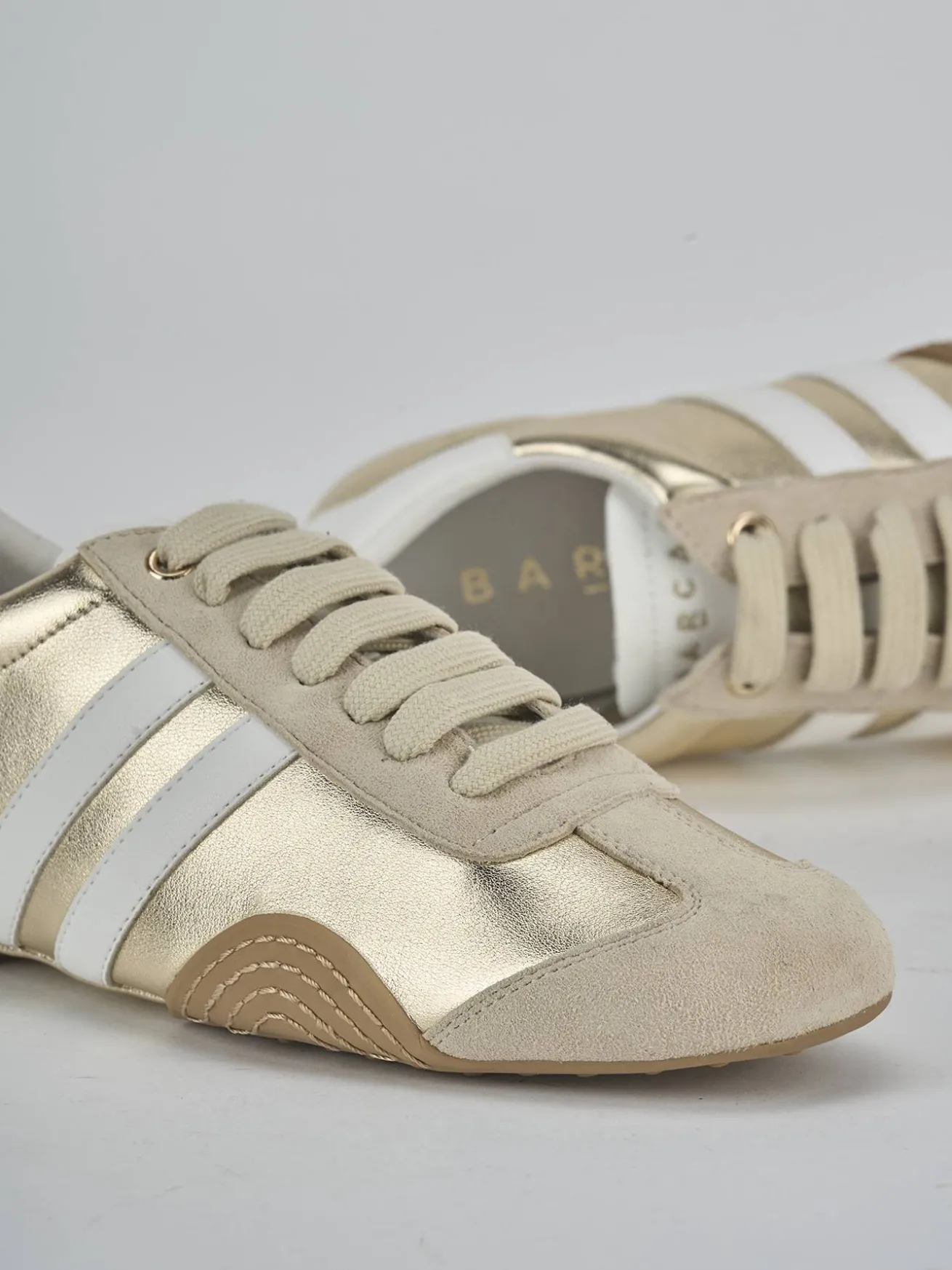 Sneakers laminato oro