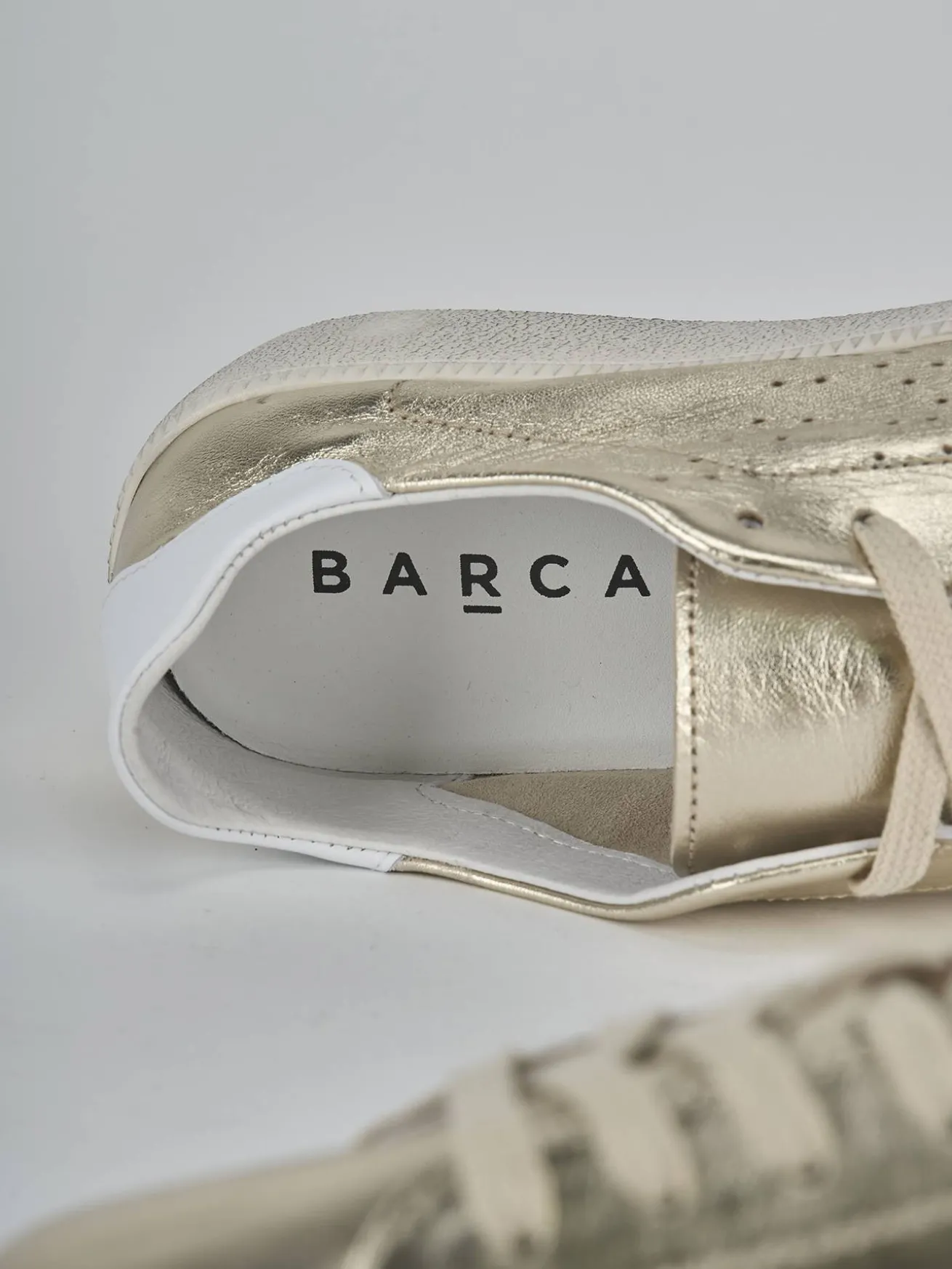 Sneakers laminato oro