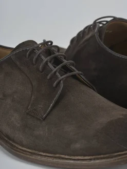 Stringate camoscio testa