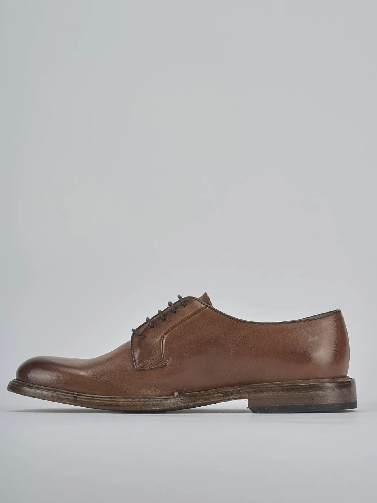 Stringate pelle testa